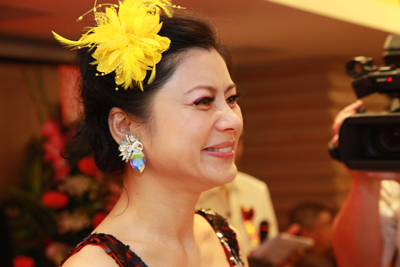 A happy matchmaker with no regrets -- Hellen Chen smiling as she sees another couple tie the knot.